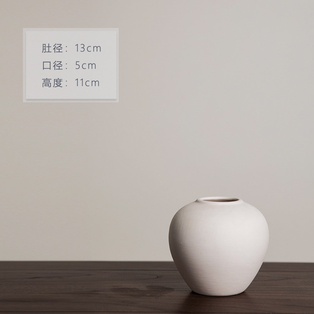 Matte ivory round orb ceramic vase, 11 cm high