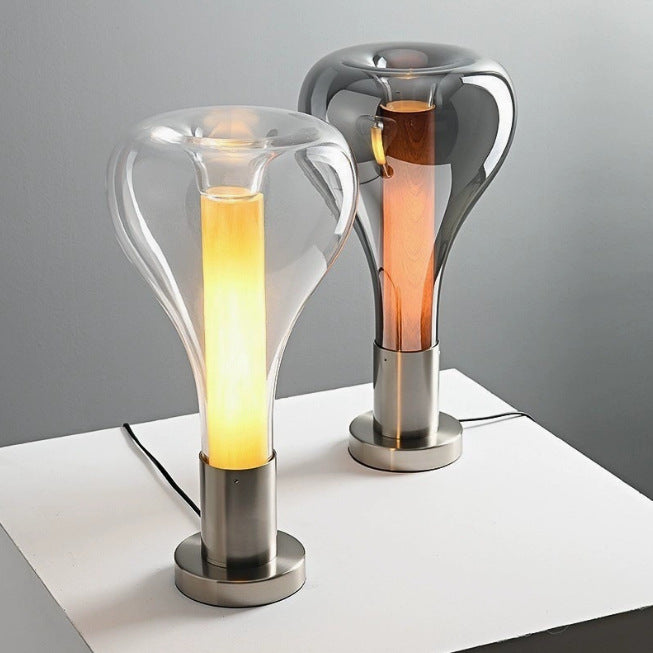Clear glass capsule table lamps with warm amber inner light