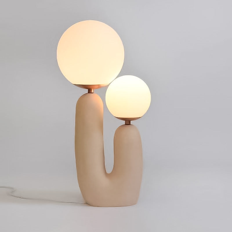 Sand beige dual globe bedside lamp illuminated