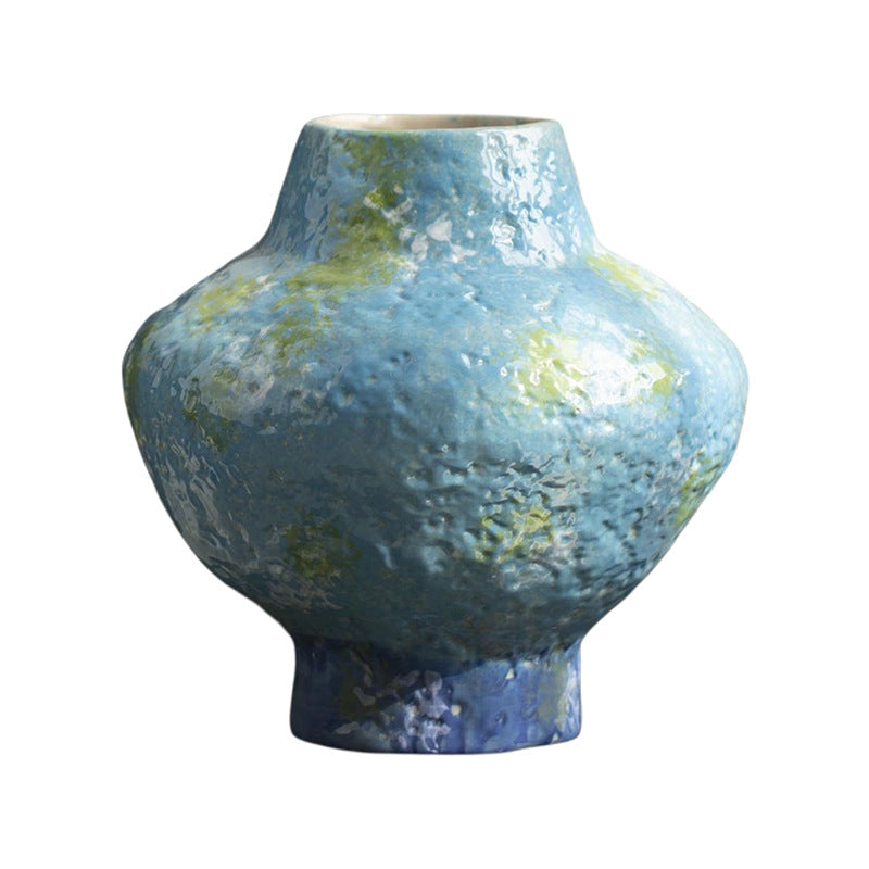 Turquoise blue mottled ceramic vase isolated product view