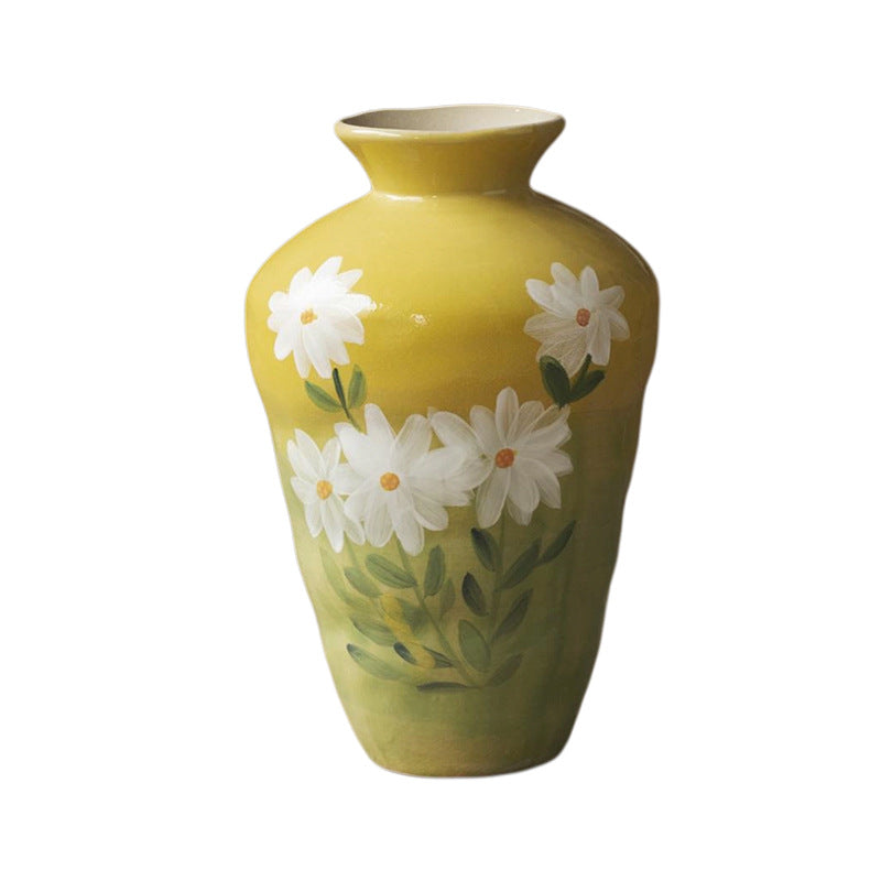 Mustard yellow hand-painted daisy ceramic vase isolated tall form