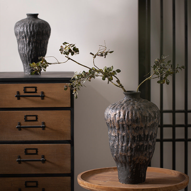 Large and small charcoal black textured ceramic vases styled together