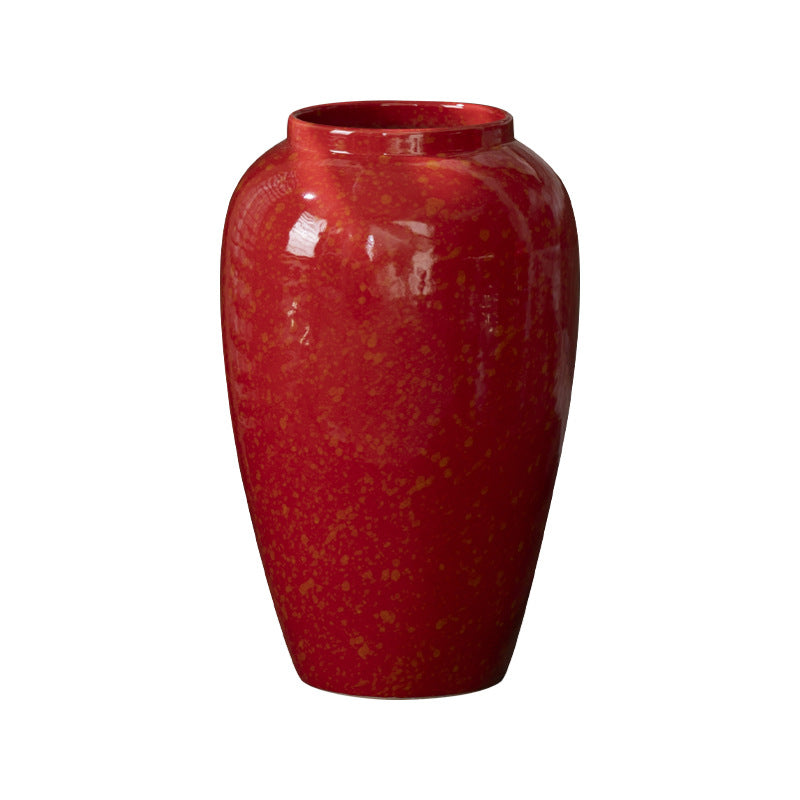 Red gold-speckled ceramic vase isolated product view