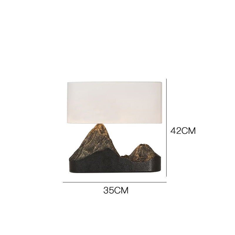 Zen mountain resin table lamp with white fabric shade 35cm by 42cm
