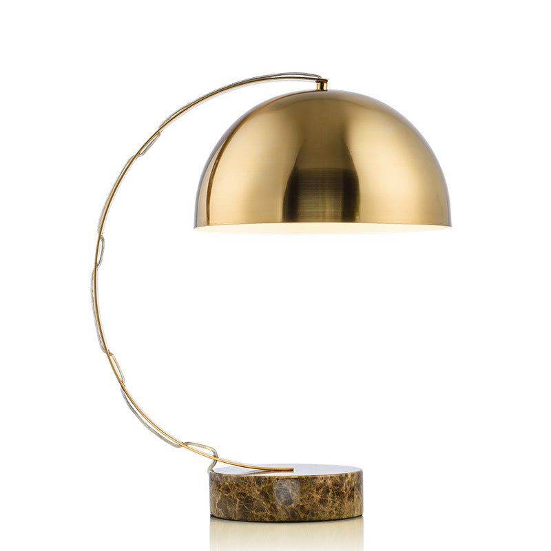 Mid century brass dome table lamp with curved arc and marble base front view
