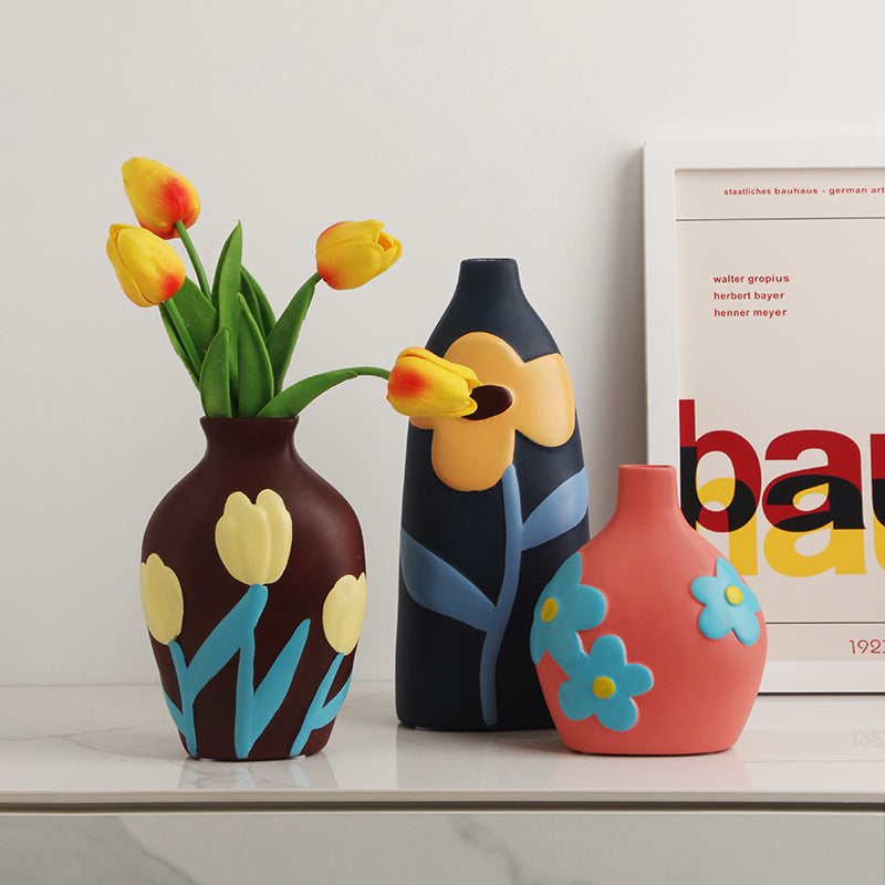 Colorful abstract hand-painted ceramic vase collection with floral and botanical motifs