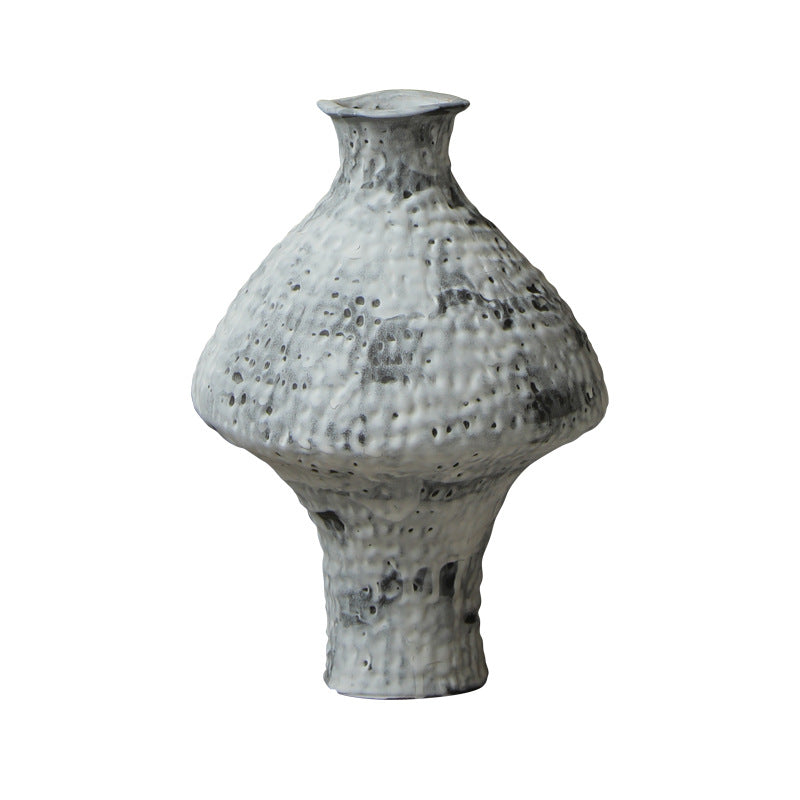 Mottled white hammered ceramic vase isolated product view