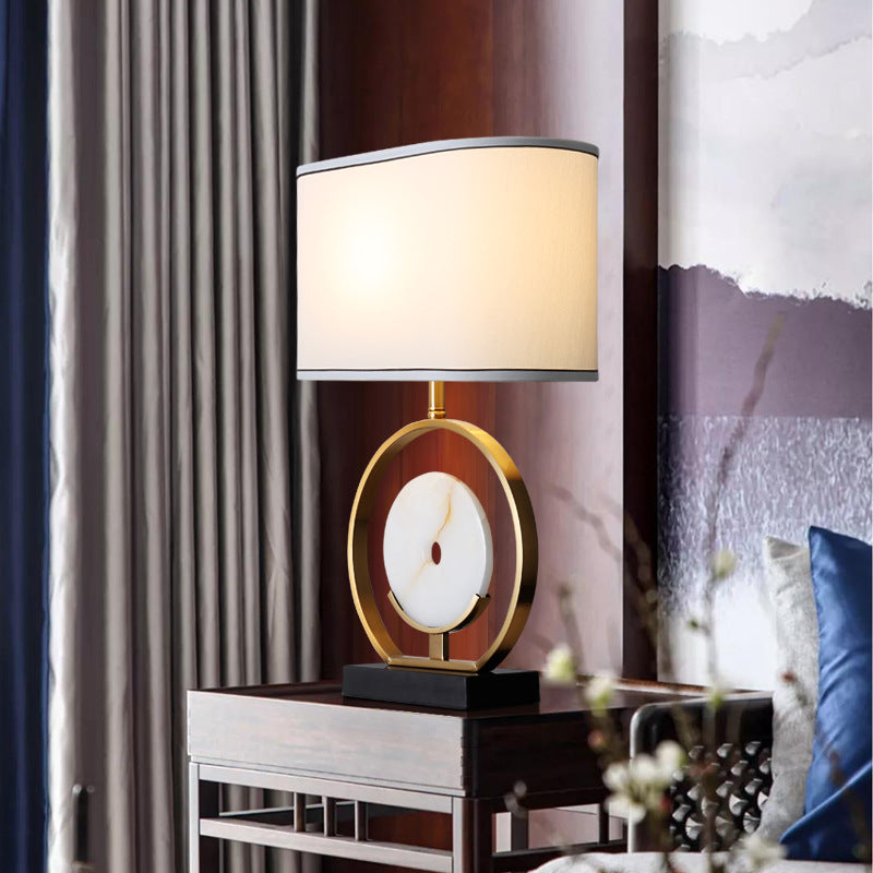 Bronze circular marble table lamp styled in bedroom