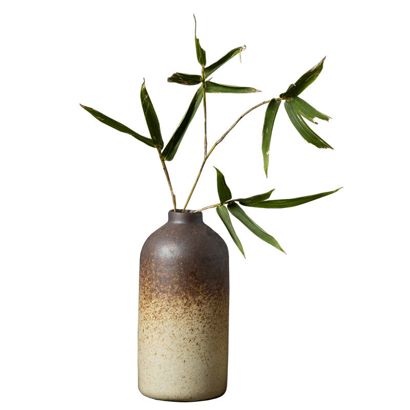 Tall brown-to-cream mini ceramic bottle vase with bamboo leaves