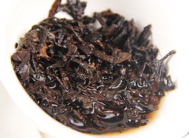 Spent ripe Pu-erh tea leaves after brewing aged 357g tea cake