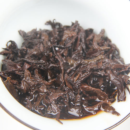 Unwrapped 2006 Peacock Homeland aged Gongting ripe Pu-erh tea cake 357g