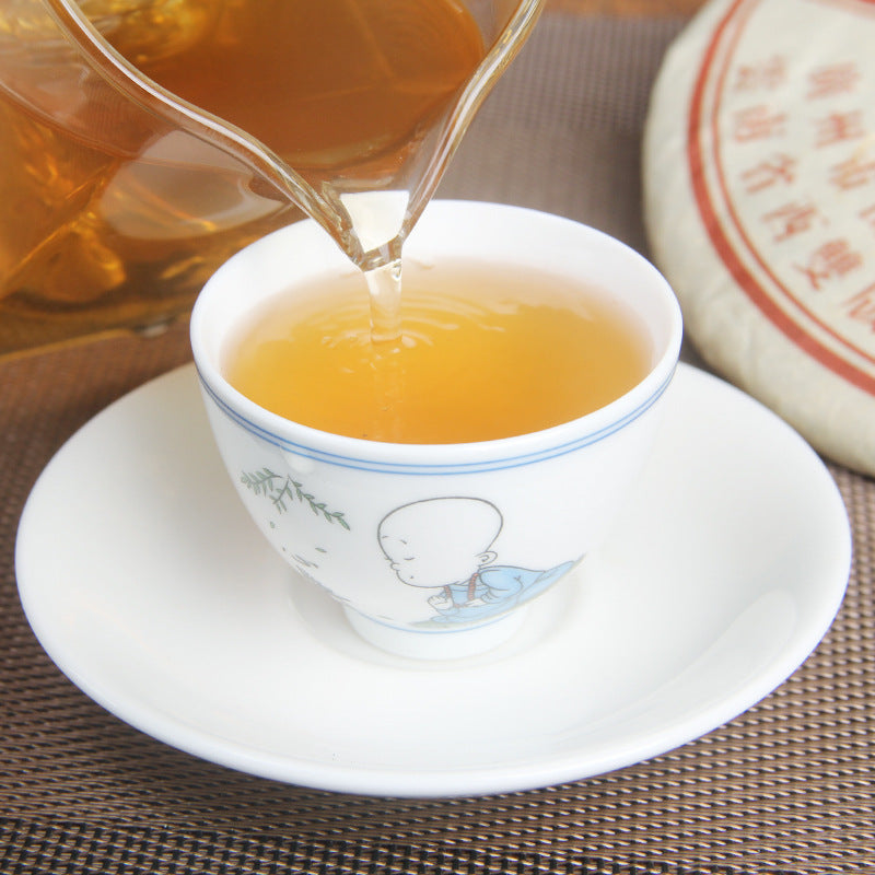 Golden liquor brewed from 2006 Puwen Yunya aged raw Pu-erh