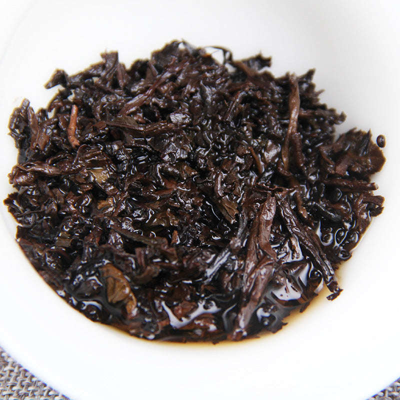 Brewed leaves of 2009 Golden Bud ripe Pu-erh tea cake