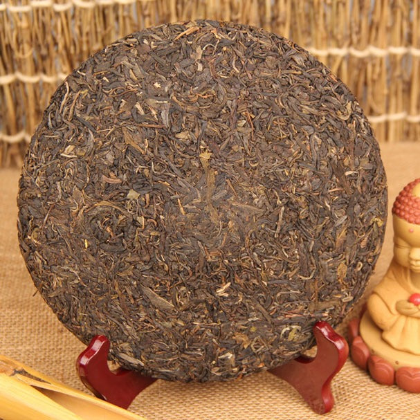 2009 material 2013 pressed Yiwu ancient-tree raw Pu-erh tea cake 357g