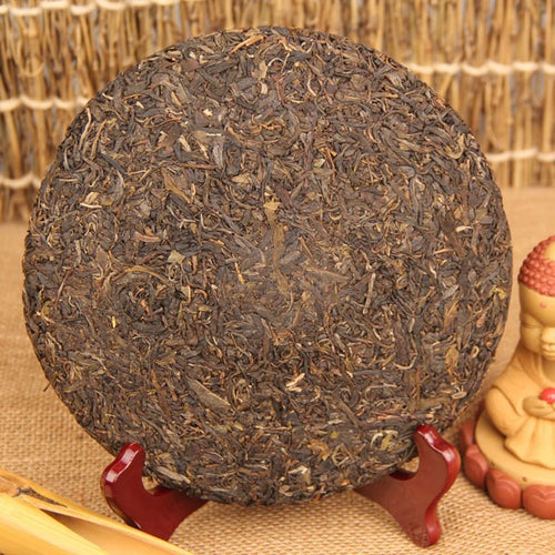2009 material 2013 pressed Yiwu ancient-tree raw Pu-erh tea cake 357g