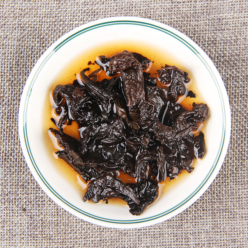 Infused leaves from 2012 Cang Chun Gu Yun aged ripe Pu-erh tea brick