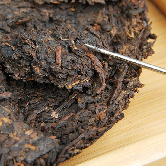 Close-up leaf detail of 2013 material 2017 pressed Menghai ripe Pu-erh tea cake