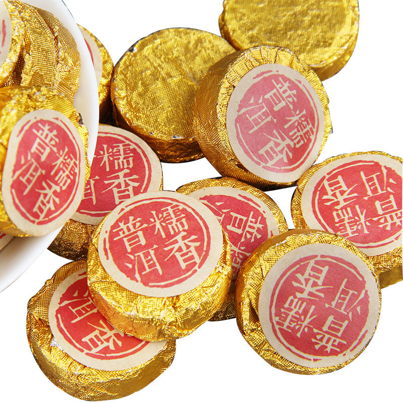 Group of gold-wrapped 2016 sticky rice aroma ripe Pu-erh mini cakes