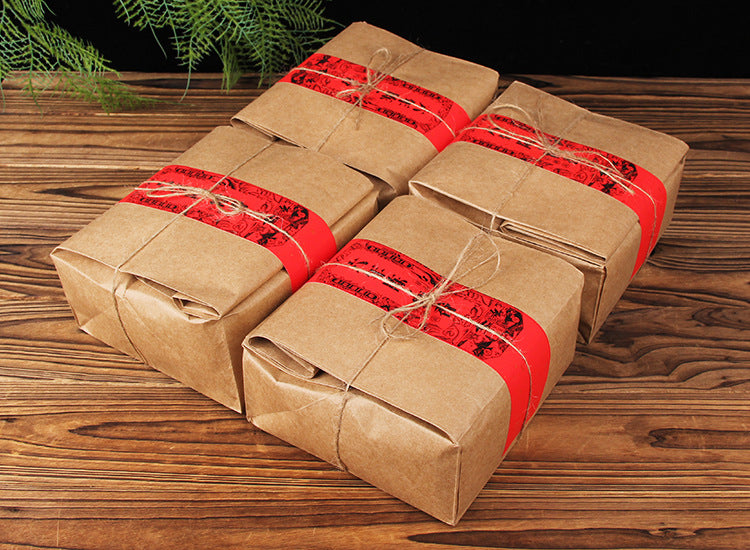 Multiple 500g kraft packs of six-year aged Bulang Mountain sticky-rice aroma ripe Pu-erh