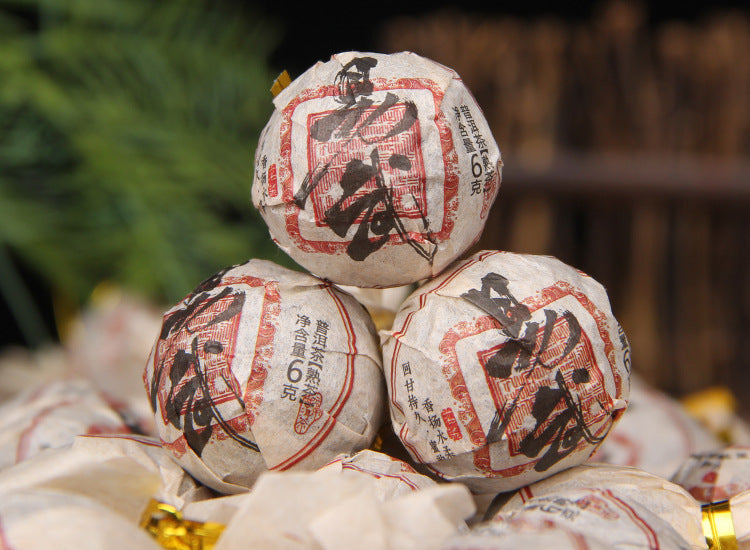 Individually wrapped Yiwu ripe Pu-erh dragon pearls