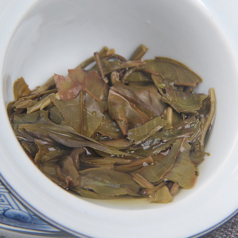 Close-up leaf texture of 2021 Bingdao Chunjian raw Pu-erh tea cake