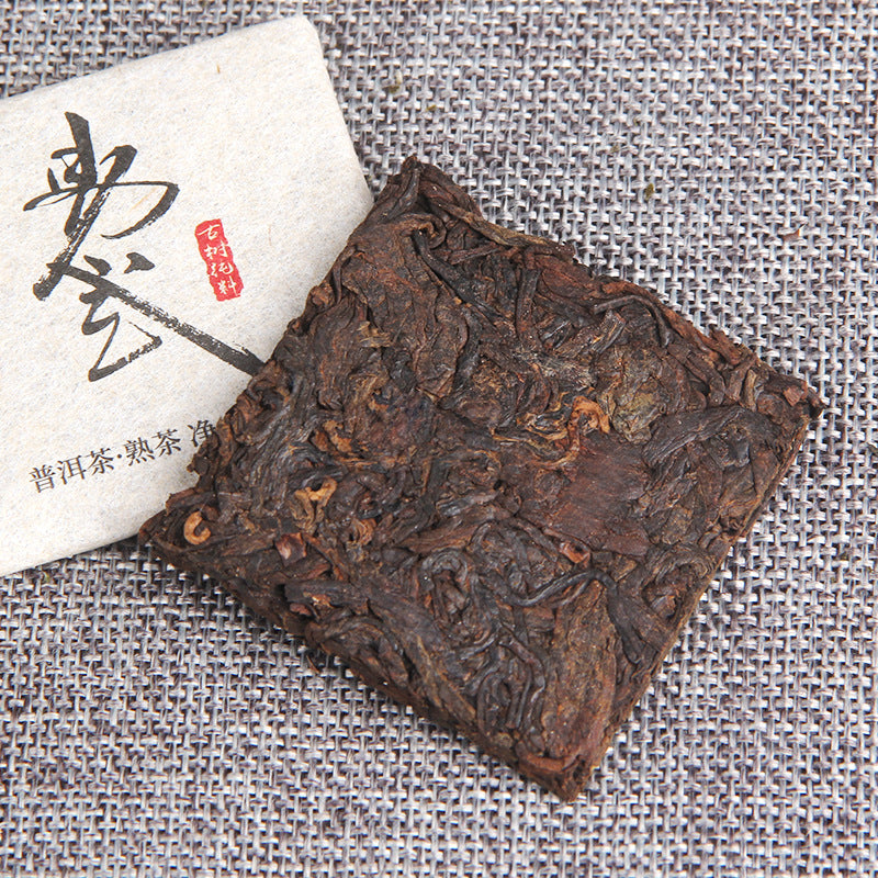 Infused leaves from 2022 Yiwu ancient-tree ripe Pu-erh mini square tea