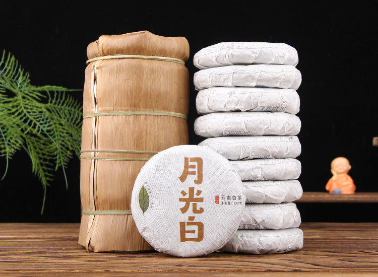 2022 Moonlight White Yunnan white tea cakes stacked with bamboo packaging 月光白