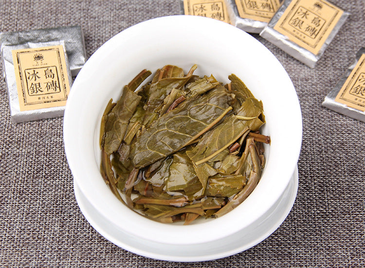 Infused leaves from 2023 Bingdao raw Pu-erh mini square tea