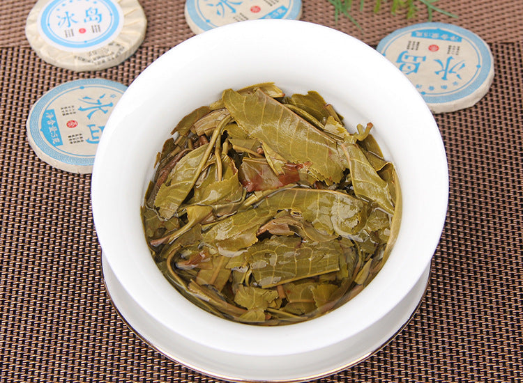 2023 Xiaobingdao raw Pu-erh mini tea cakes with blue wrappers and tea liquor