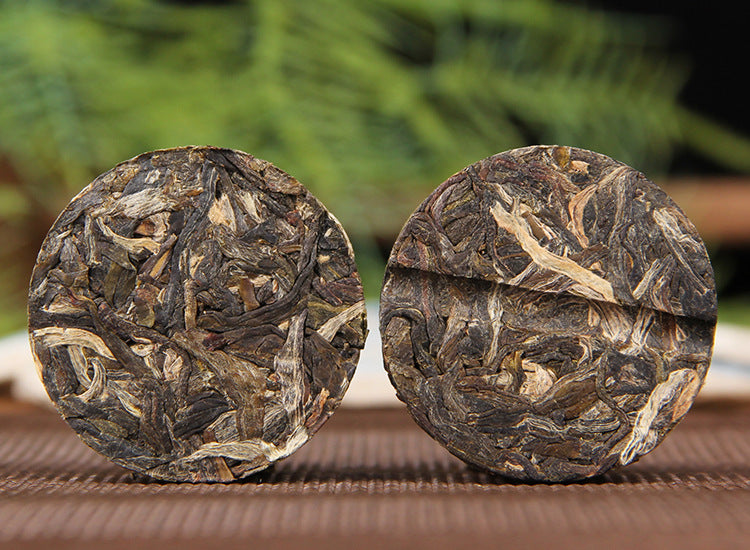 Bingdao sweet raw Pu-erh mini cakes with blue packaging for portable tea brewing