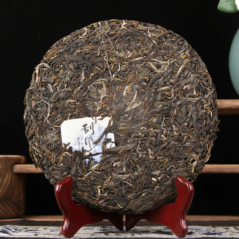 Yiwu Guafengzhai raw Pu-erh tea cake lifestyle image