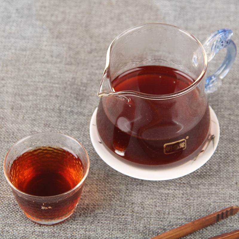 Deep red liquor brewed from 2023 original ripe Pu-erh mini tuocha