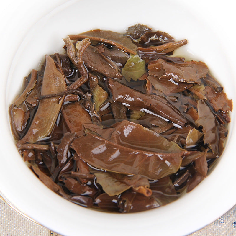 Infused leaves from 2023 Yunnan Moonlight White mini tea cake
