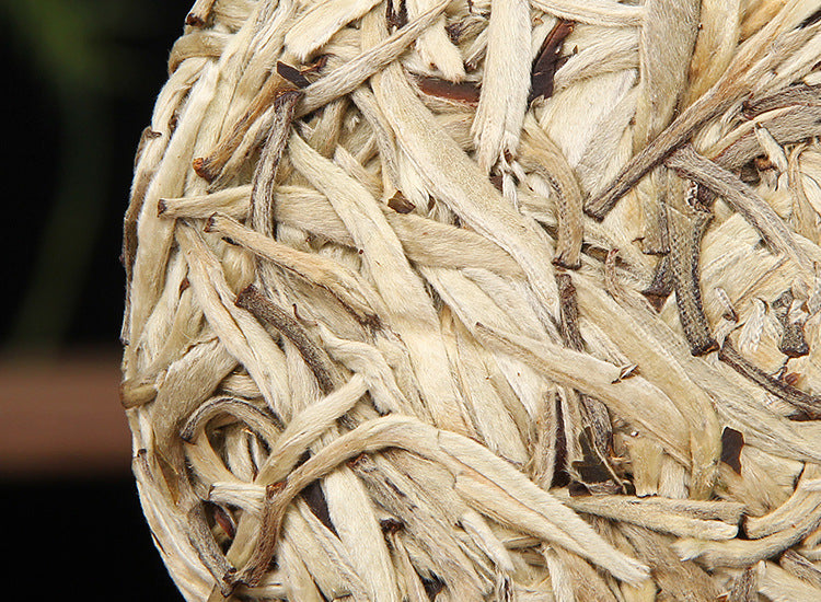 Baihao Yinzhen white tea cake lifestyle image