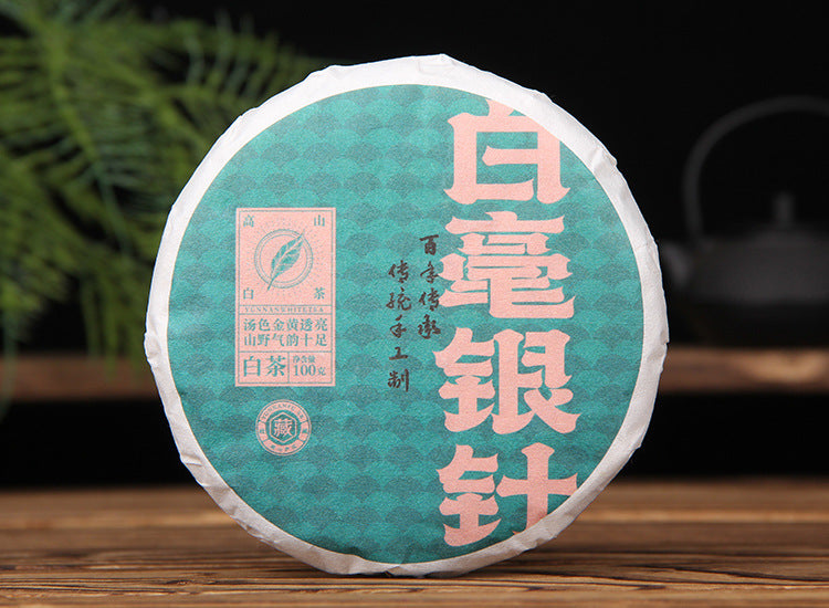 Yunnan Silver Needle white tea cake and leaf