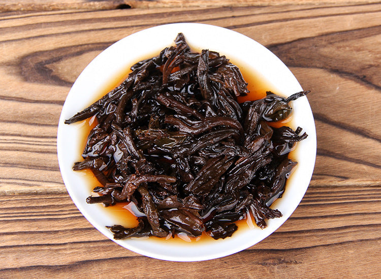 Infused leaves of 2025 Bulang Guyun ripe Pu-erh tea 357g shou puer