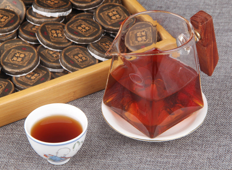 Wrapped Chenpi ripe Pu-erh mini cake close-up