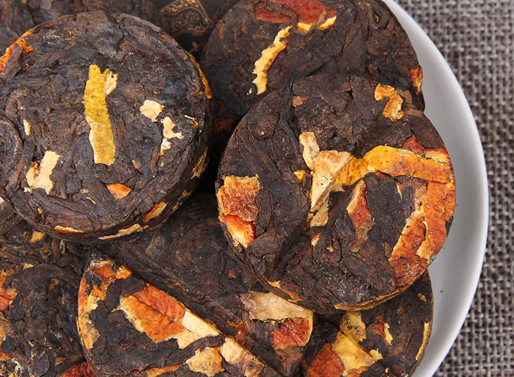Chenpi ripe Pu-erh mini cakes with dark fermented tea leaf