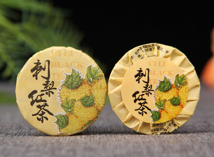 Wrapped Cili chestnut rose Dianhong mini tea cakes showing front and reverse wrappers