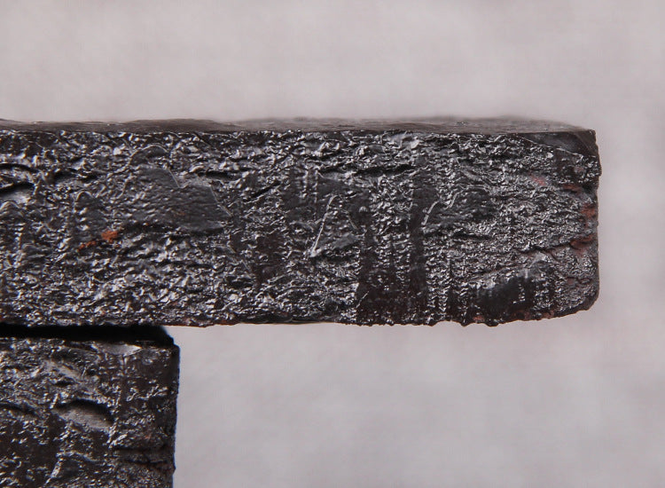 Close-up edge texture of concentrated ripe Pu-erh tea paste brick