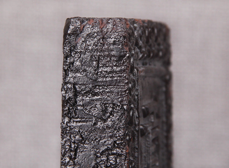 Embossed side and textured surface of Gongpin Pu-erh tea paste brick