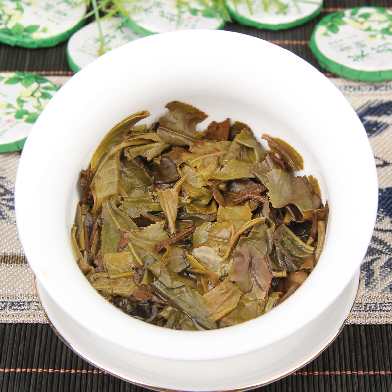 Brewed leaves from 2025 jasmine aroma raw Pu-erh mini tea cakes