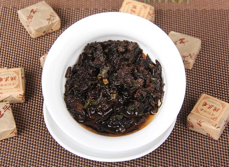 Sticky Rice Aroma Aged Ripe Pu-erh mini bricks stacked wrapped and unwrapped 糯米香