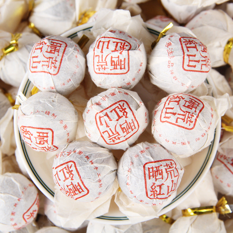 2026 Yunnan wild-mountain sun-dried Dianhong black tea dragon pearls in white wrappers