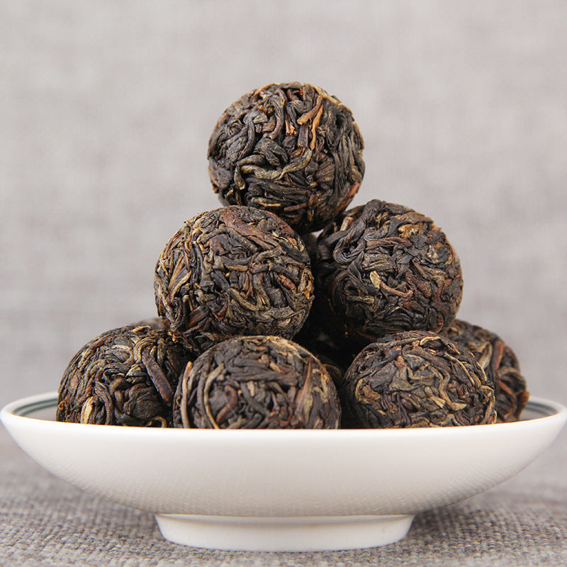 Unwrapped compressed Yunnan Dianhong black tea dragon pearls