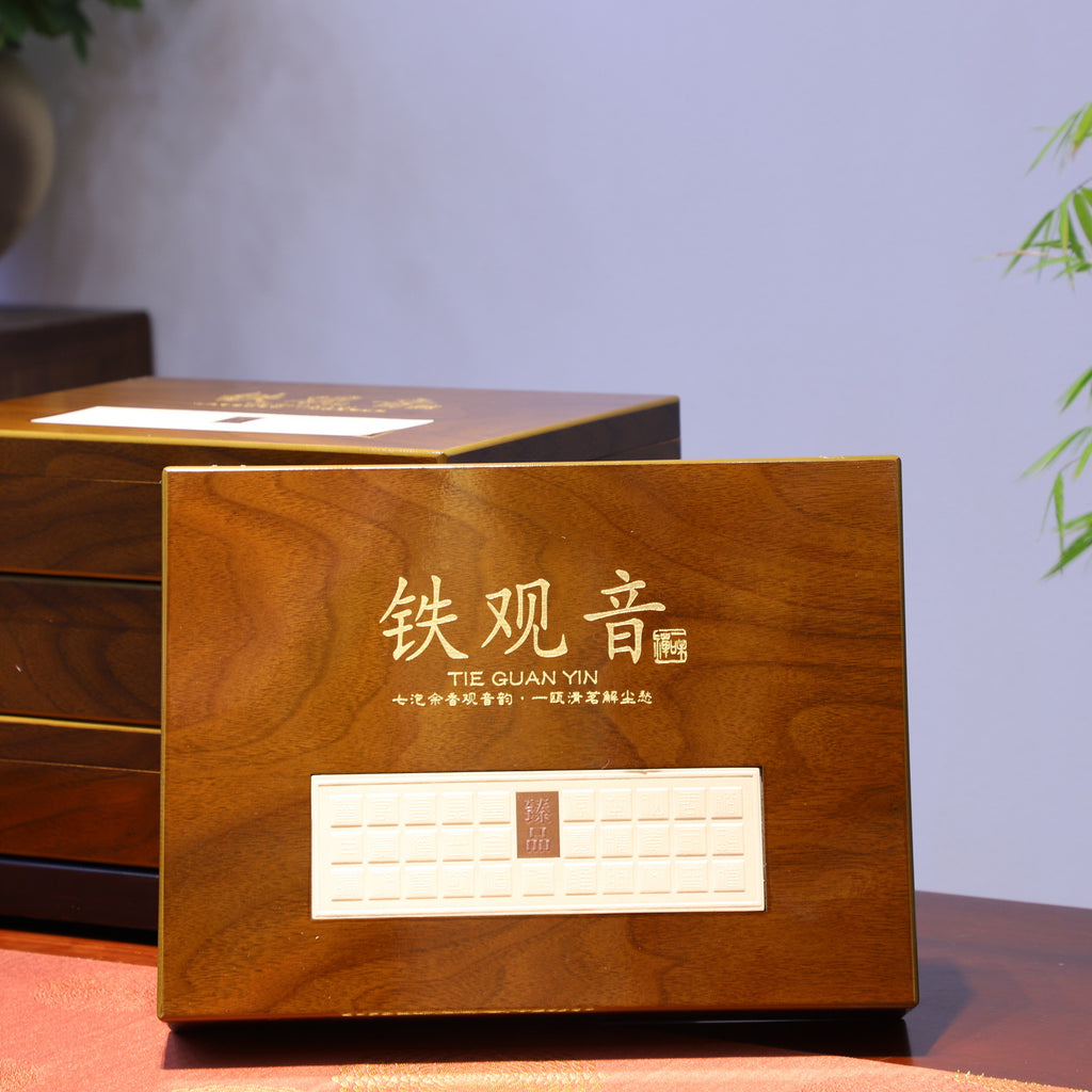 Four tea tins inside premium wooden Tie Guan Yin chest