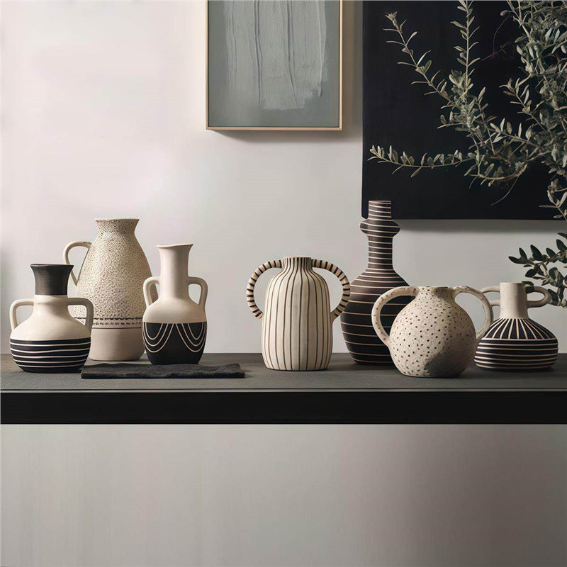 Contemporary artisan ceramic vase collection styled on a long console