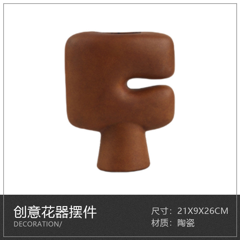 Compact brown cutout pedestal ceramic vase, 21 x 9 x 26 cm
