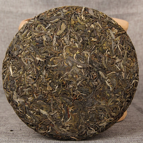 Bangdong ancient-tree raw Pu-erh 357g cake lifestyle image