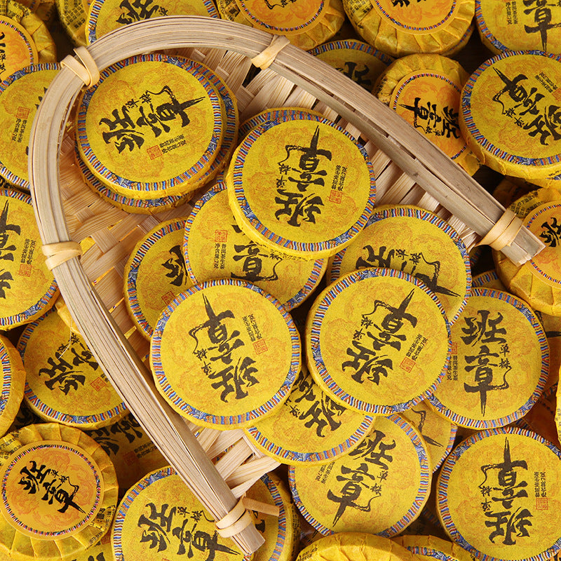 Banzhang raw Pu-erh mini tea cakes in yellow wrappers